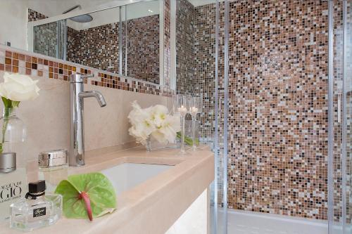 a bathroom with a sink and a shower at Hotel Navona in Rome