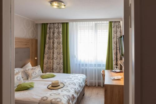 Кровать или кровати в номере Central Boutique Hotel