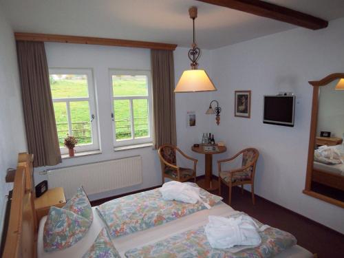Postel nebo postele na pokoji v ubytování Hammermühle Hotel & Gesundheitsresort