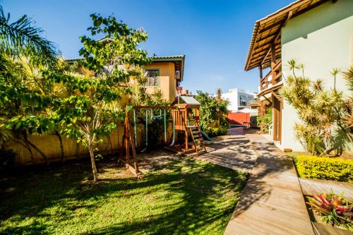 a yard with a playground in a house at Pousada Do Capitão in Florianópolis