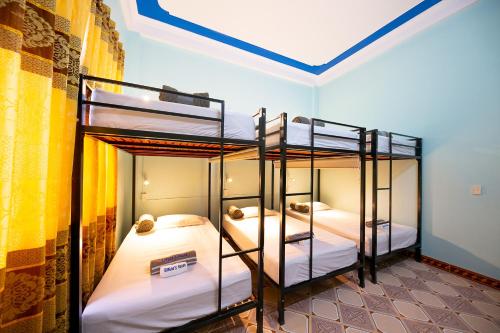 Ένα ή περισσότερα κρεβάτια σε δωμάτιο στο Bamboo's House