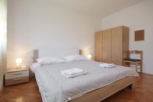 Ένα ή περισσότερα κρεβάτια σε δωμάτιο στο Apartment Mirela