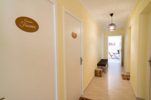 a hallway with a door to a room with a table at Lyon Mon Amour B&B in Lyon