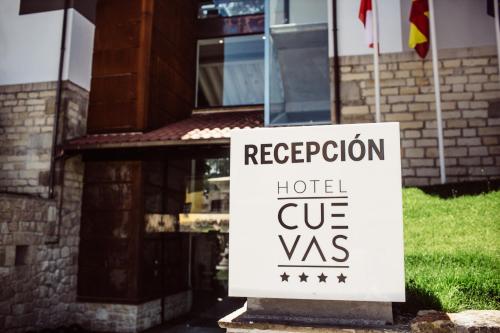 a sign in front of a house with a hotel cvs at Hotel Cuevas - Adults Only in Santillana del Mar