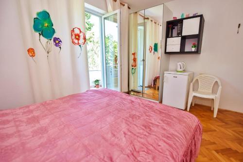 A bed or beds in a room at Apartments Villa Milenka