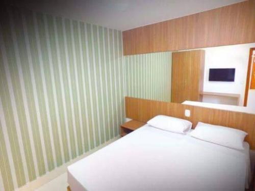 Łóżko lub łóżka w pokoju w obiekcie Apartamento Encontro das Aguas - Caldas Novas