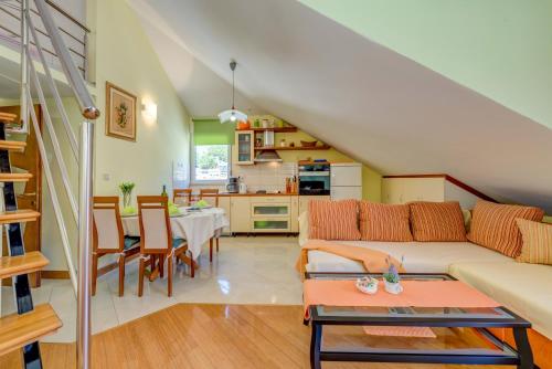 a living room with a couch and a table at Natali in Omiš