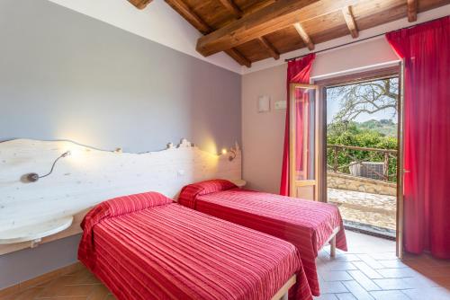 Postel nebo postele na pokoji v ubytování Agriturismo Dei Casali