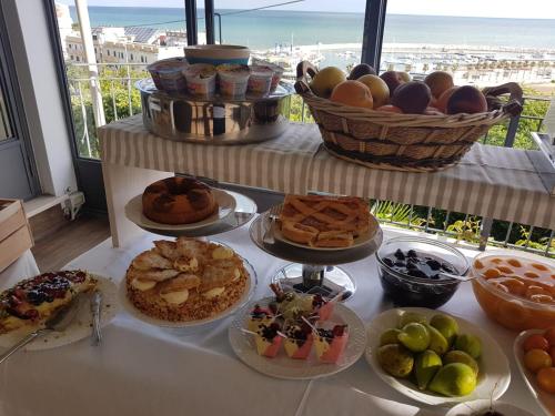 a table with different types of food on it at Albergo Villa Vittoria in Rodi Garganico
