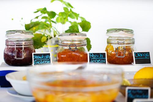 a group of jars of food sitting on a table at Hotel Torre Barbara in Vico Equense