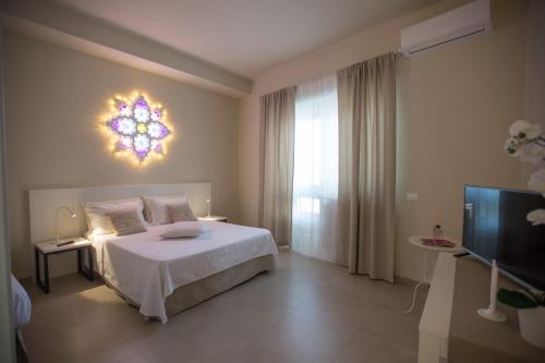 Katil atau katil-katil dalam bilik di Luci del Salento Guest House