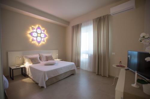 Posteľ alebo postele v izbe v ubytovaní Luci del Salento Guest House