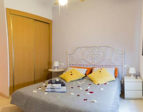 Posteľ alebo postele v izbe v ubytovaní MALAMA Apartamentos Turísticos