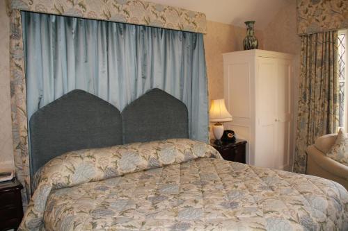Postel nebo postele na pokoji v ubytování Rylstone Manor