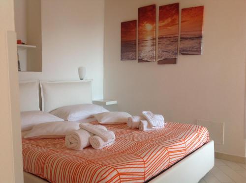 A bed or beds in a room at Casa Vacanze Albachiara