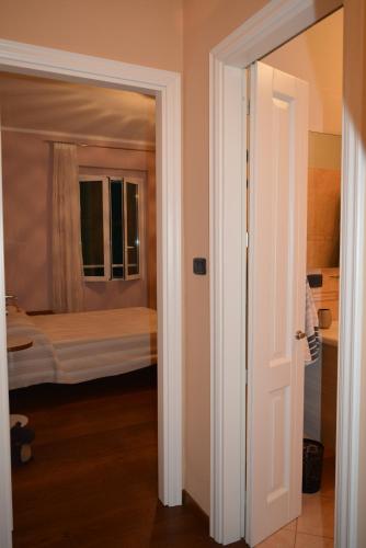 a door leading to a bedroom with a bed at ilGirasole b&b in Rapallo