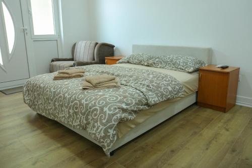 Postel nebo postele na pokoji v ubytování Apartments Oki