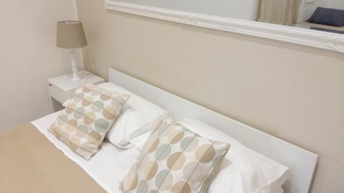 Appartamenti e Camere Silva Trapaniにあるベッド