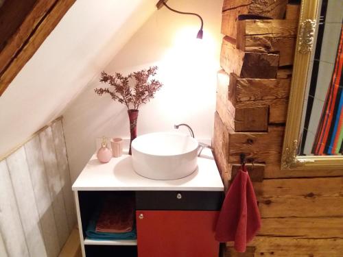 a bathroom with a sink in the attic at Mulgi Apartment in Viljandi