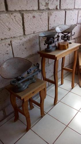 a couple of tables with pans on top of them at Hotel Mirador Real in Bernal
