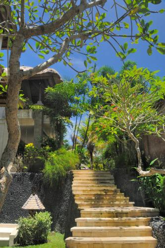 a set of stairs in front of a building at Samhita Garden Ubud in Ubud