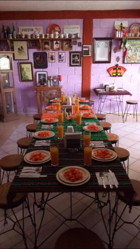 a long table with plates of food on it at Hotel Mirador Real in Bernal