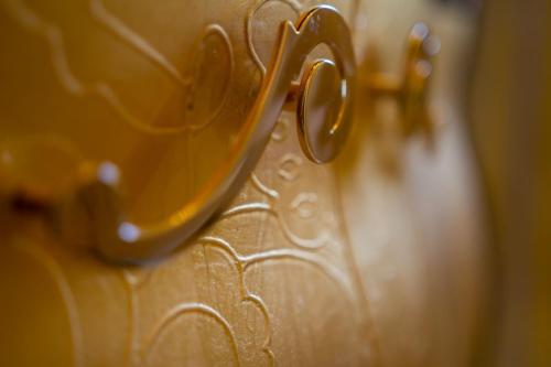 a close up of a pair of scissors on a vase at Villa Vanessa in Leuca