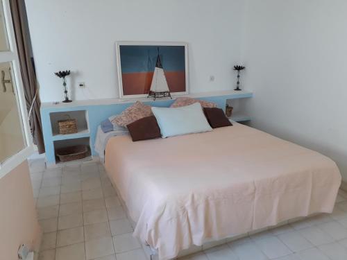 Postel nebo postele na pokoji v ubytování Dar es Salam-Alta