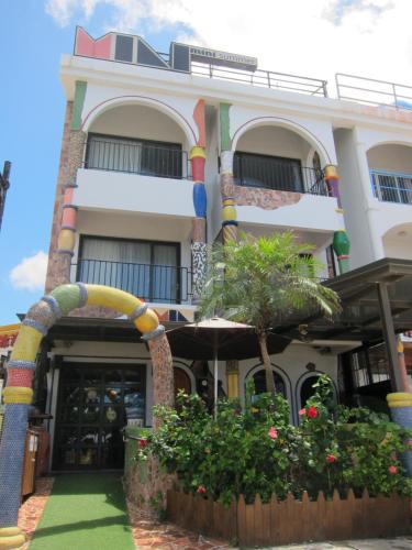 a building with an archway in front of it at Mini Summer in Nanwan