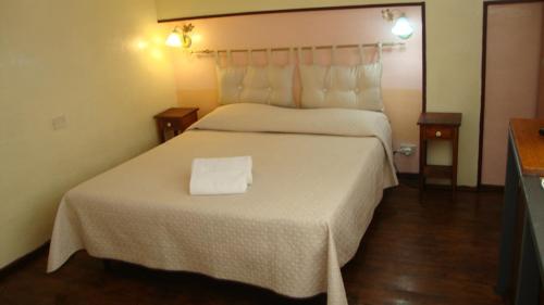 Ένα ή περισσότερα κρεβάτια σε δωμάτιο στο Bed & Breakfast Delle Palme