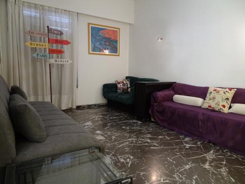 a living room with a floor covered in marble at Eva's Urban Apt in Athens 6' to Transit Station in Athens