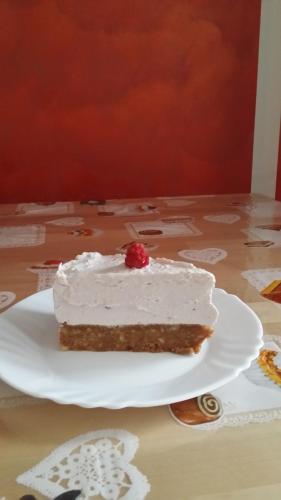 a piece of cake on a plate on a table at La Casa Del Grillo 1 in Aosta