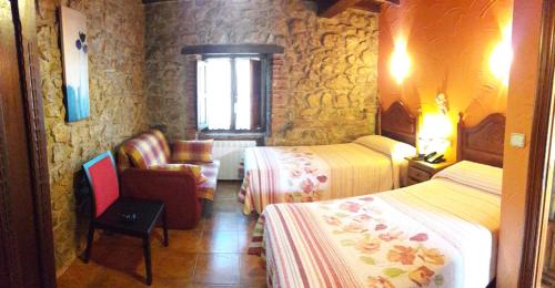 Postel nebo postele na pokoji v ubytování Hotel Alda
