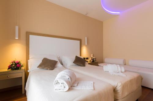 Ένα ή περισσότερα κρεβάτια σε δωμάτιο στο Hotel Villa Esperia