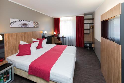 Postel nebo postele na pokoji v ubytování Hotel Munich City