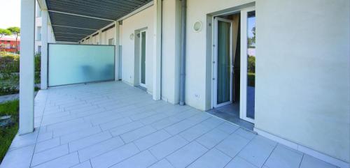 an empty walkway outside of a building at Toscana Charme Resort in Tirrenia