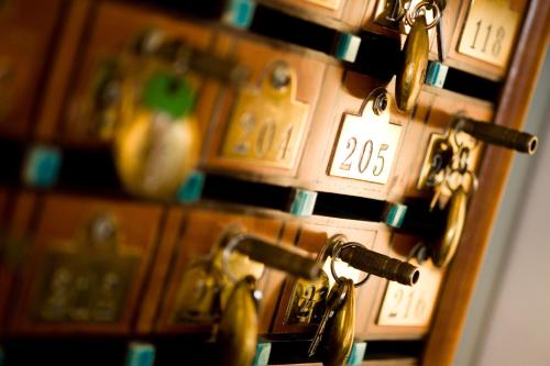 a close up of a bunch of locks on a door at Hotel Savoia in Alassio