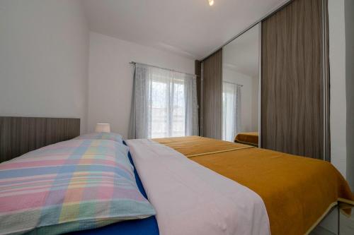 Cama o camas de una habitación en Apartman Jasmina