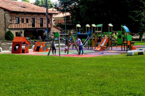 a group of people playing in a playground at Hotel Los Angeles in Santillana del Mar