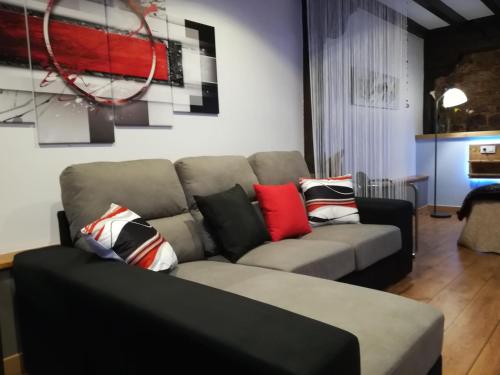 a living room with a couch with pillows on it at Posada Ormas in Ormas