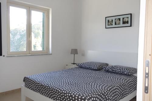 Postel nebo postele na pokoji v ubytování Terrazzo A7