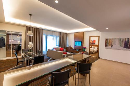 a living room with a dining and living room at Citea Apart Hotel in Beirut