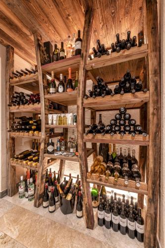 a room filled with lots of bottles of wine at Mountain Lodge Prennanger in Schenna