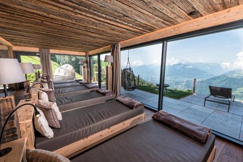 a room with a view of the mountains at Mountain Lodge Prennanger in Schenna