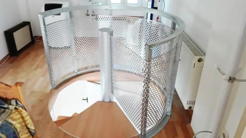 a metal cage with a circle in a room at Perikleshills in Thermisia