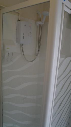 a shower in a bathroom with a shower at The Monsell Hotel in Skegness