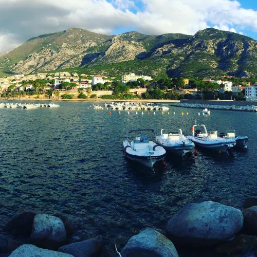 a group of boats in a body of water at Casa M&M in Cala Gonone