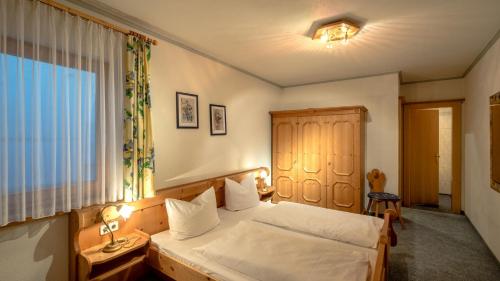 Ein Bett oder Betten in einem Zimmer der Unterkunft Appartementanlage Kerber