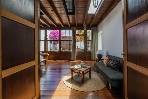 a living room with a couch and a table at Hotel Boutique Palacio Ico - Only Adults in Teguise