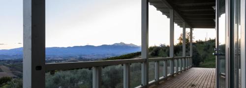 a balcony of a house with a view of the mountains at Casa San Martino in Atri